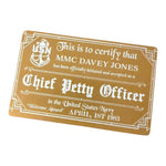My Store gold aluminum Navy Chief acceptance card with engraved US Navy emblem and personalized details.